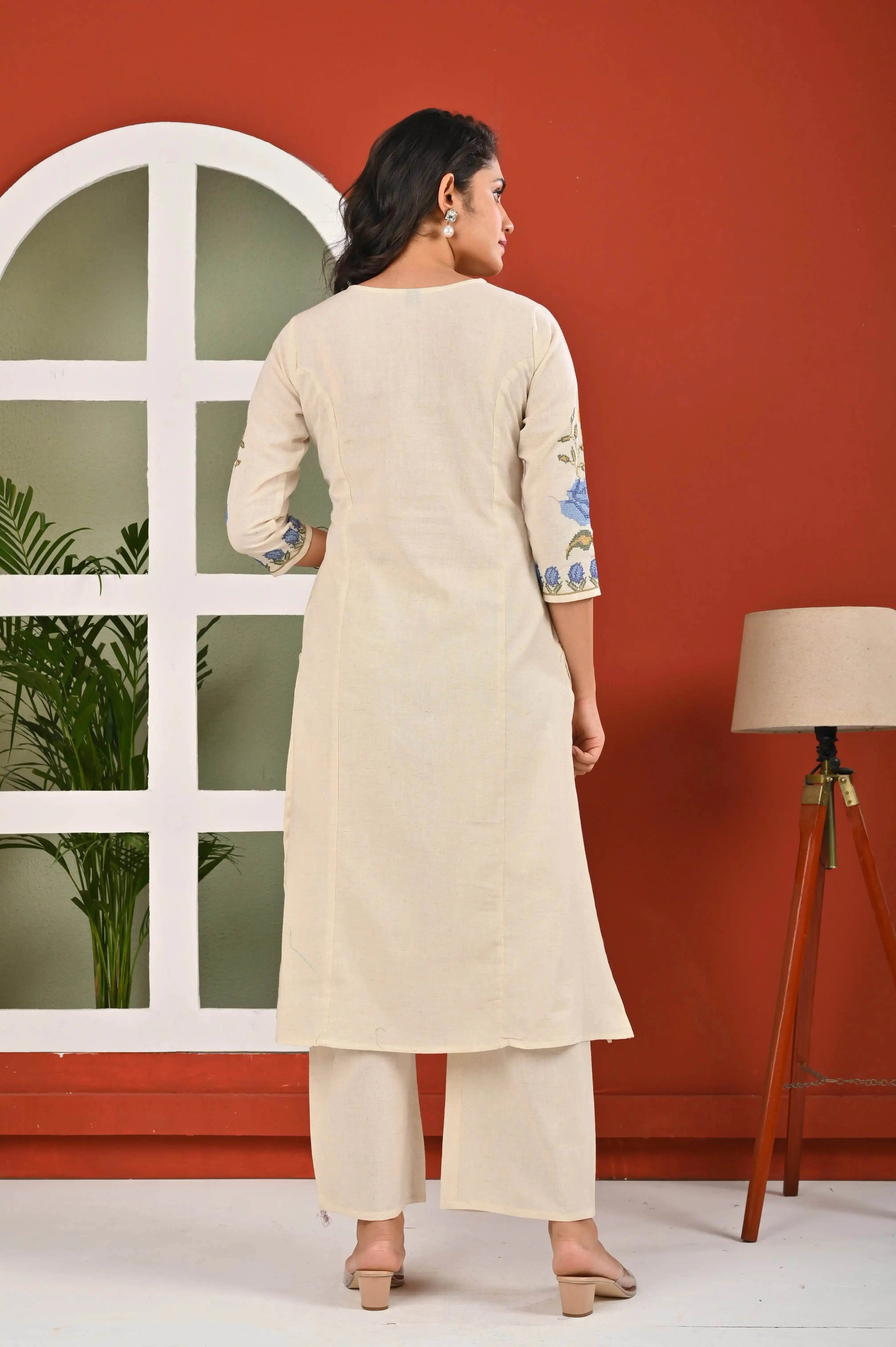 Back view of elegant floral kurti for women in beige with blue floral embroidery on sleeves