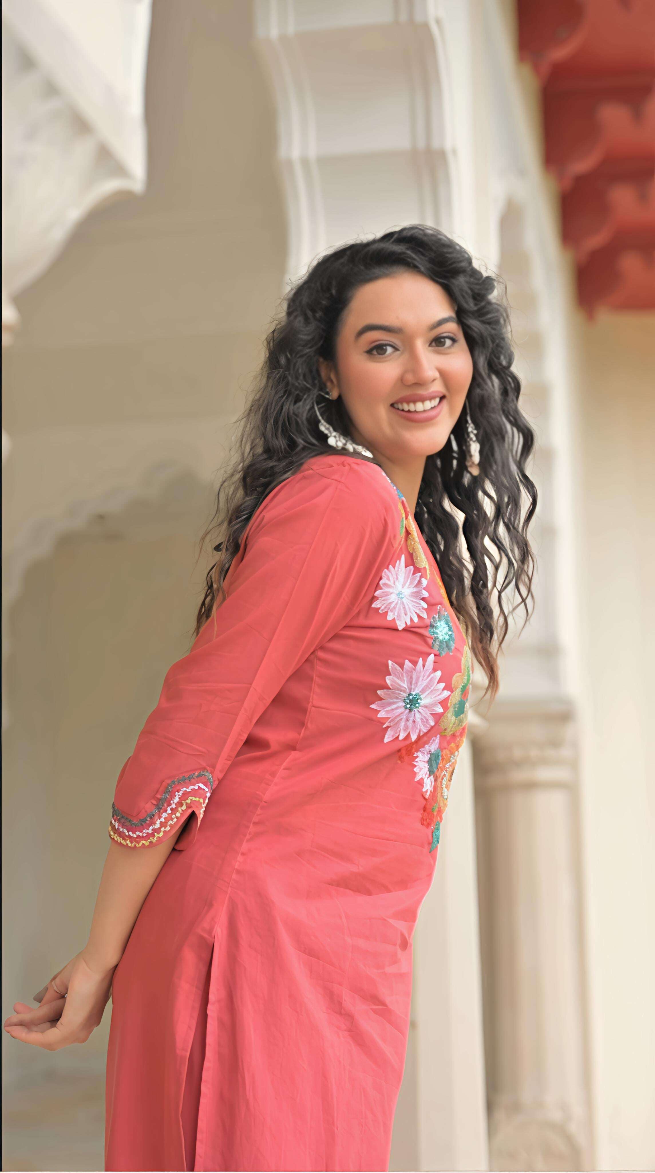 Belveera embroidered kurta pant set for women in coral with floral designs and three-quarter sleeves