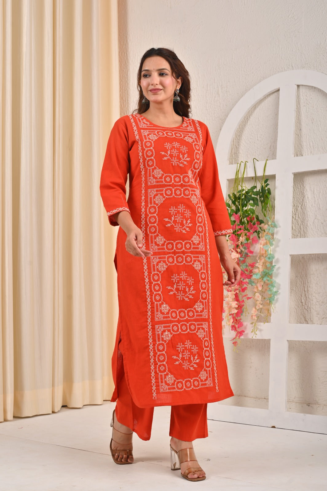 Elegant floral printed kurta pant set in orange with intricate embroidery for stylish comfort