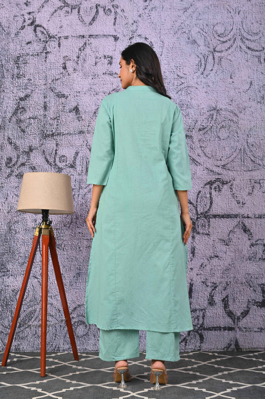 Model wearing a green cotton kurta set, showcasing the back view and relaxed fit
