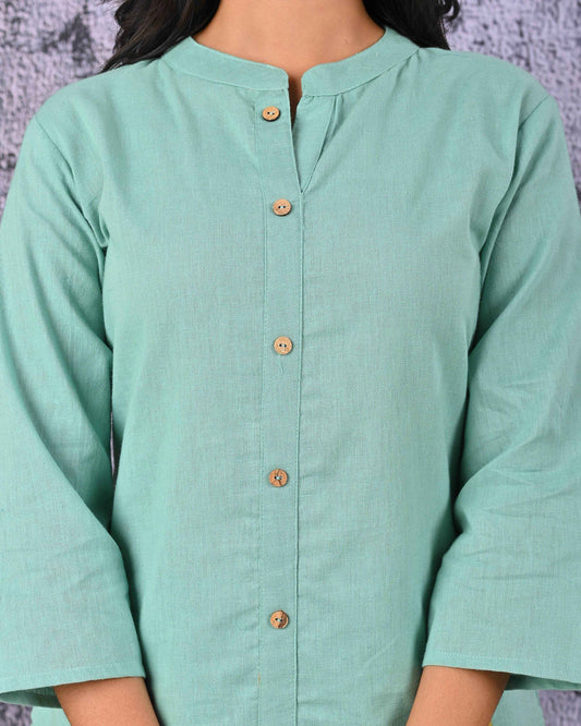Elegant green cotton kurta set with button detailing and three-quarter sleeves for a stylish look