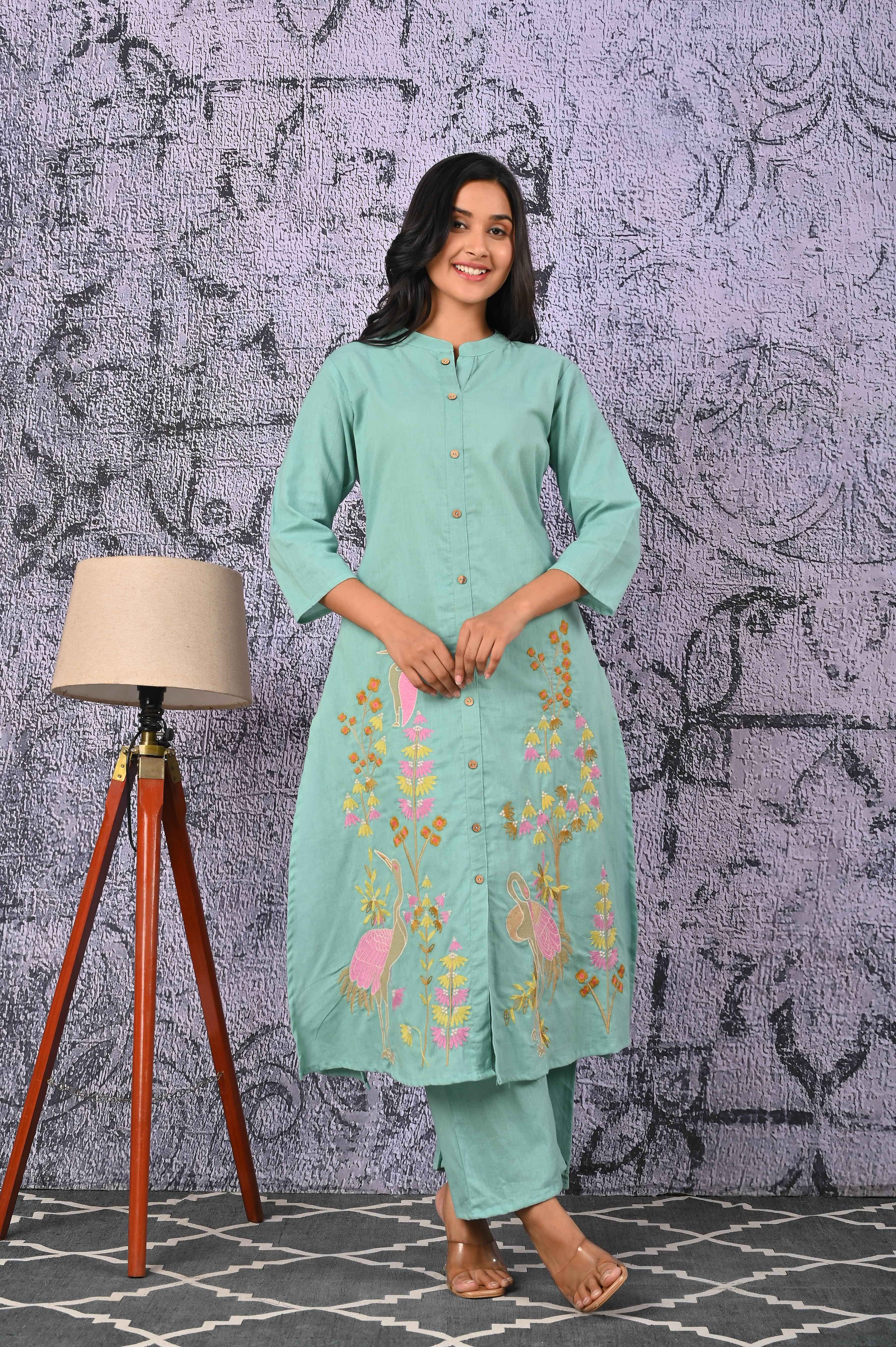 Green cotton kurta set featuring floral embroidery and a comfortable fit for casual wear