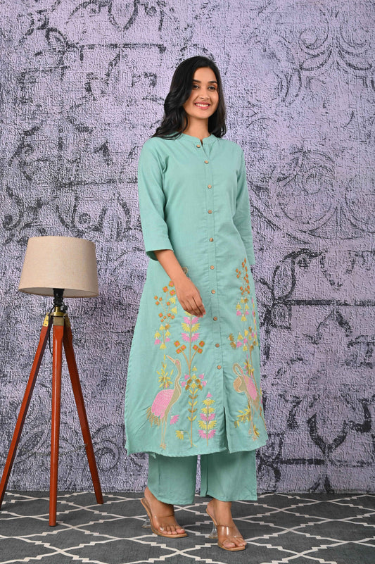 Green cotton kurta set featuring floral embroidery, ideal for casual occasions and comfortable wear