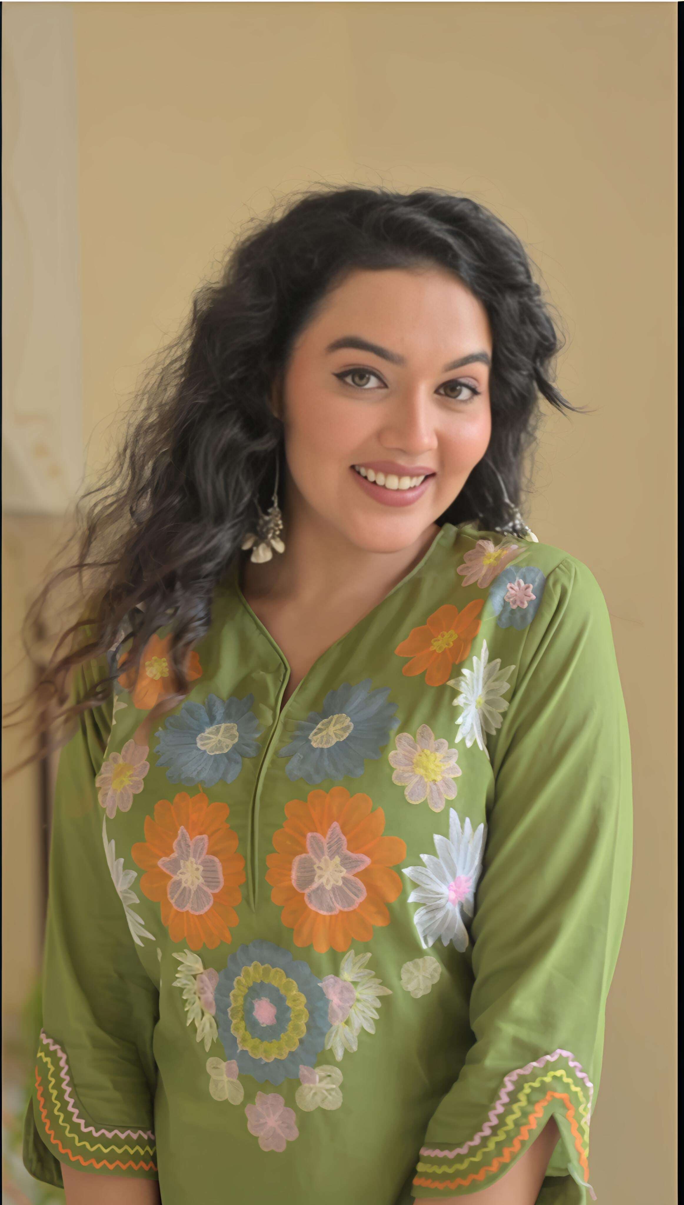 Belveera green cotton kurta set for women with colorful floral embroidery and a relaxed fit