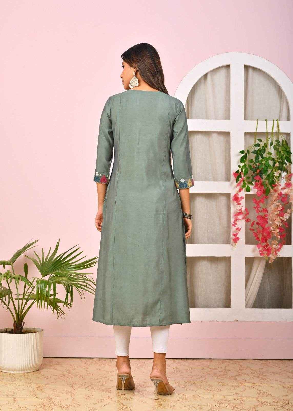Back view of a stylish green embroidered kurta for women with three-quarter sleeves and floral details