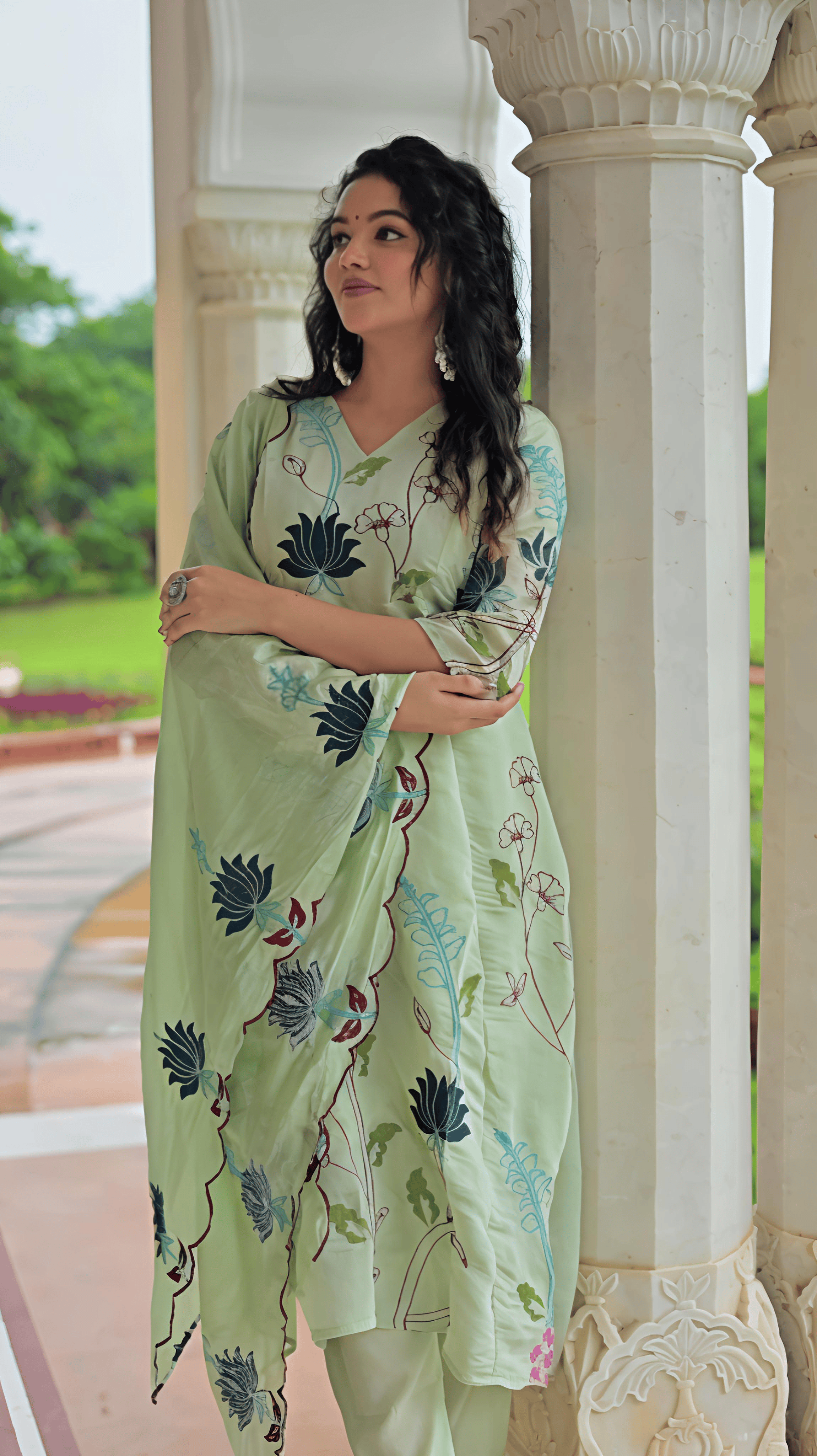 Elegant light green Chanderi suit set featuring floral designs and a comfortable fit for casual occasions