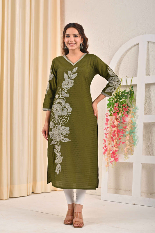 Olive green embroidered kurta with floral design, worn by a model in a stylish setting