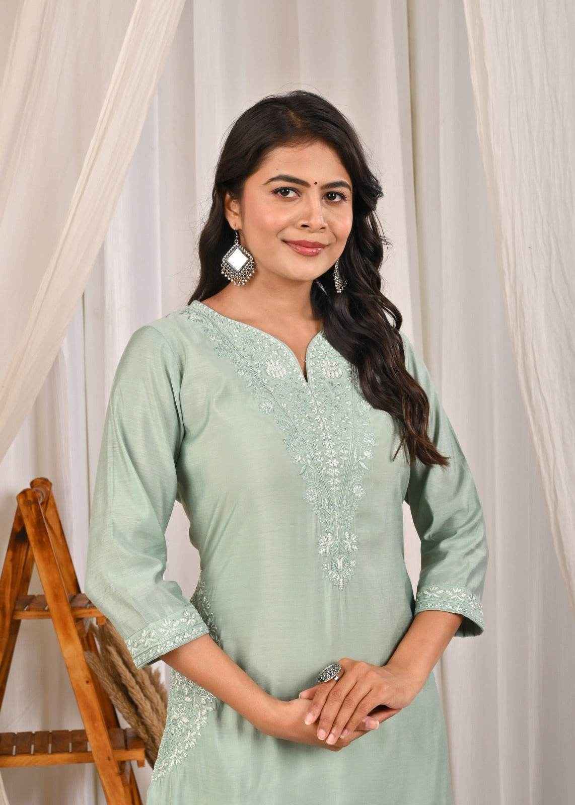 Pastel mint green silk kurta with intricate embroidery and three-quarter sleeves for elegant style