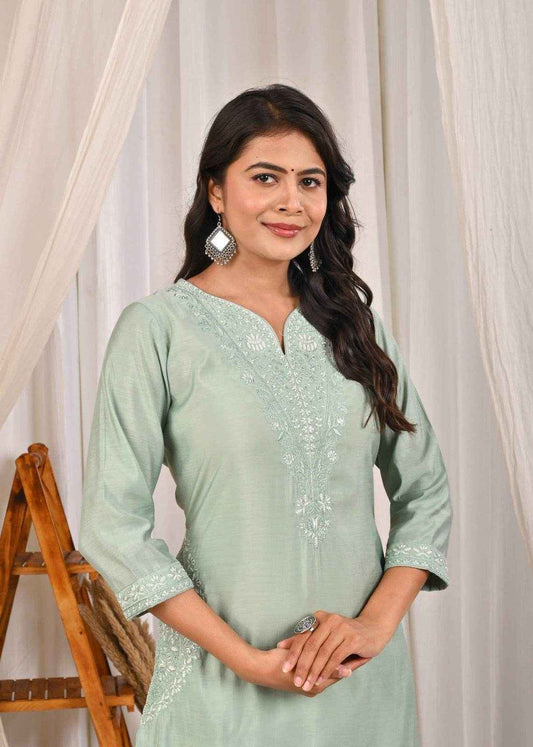 Pastel mint green silk kurta with intricate embroidery and three-quarter sleeves for elegant style