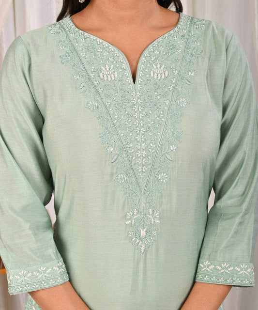 Pastel mint green silk kurta with intricate embroidery and a flattering neckline
