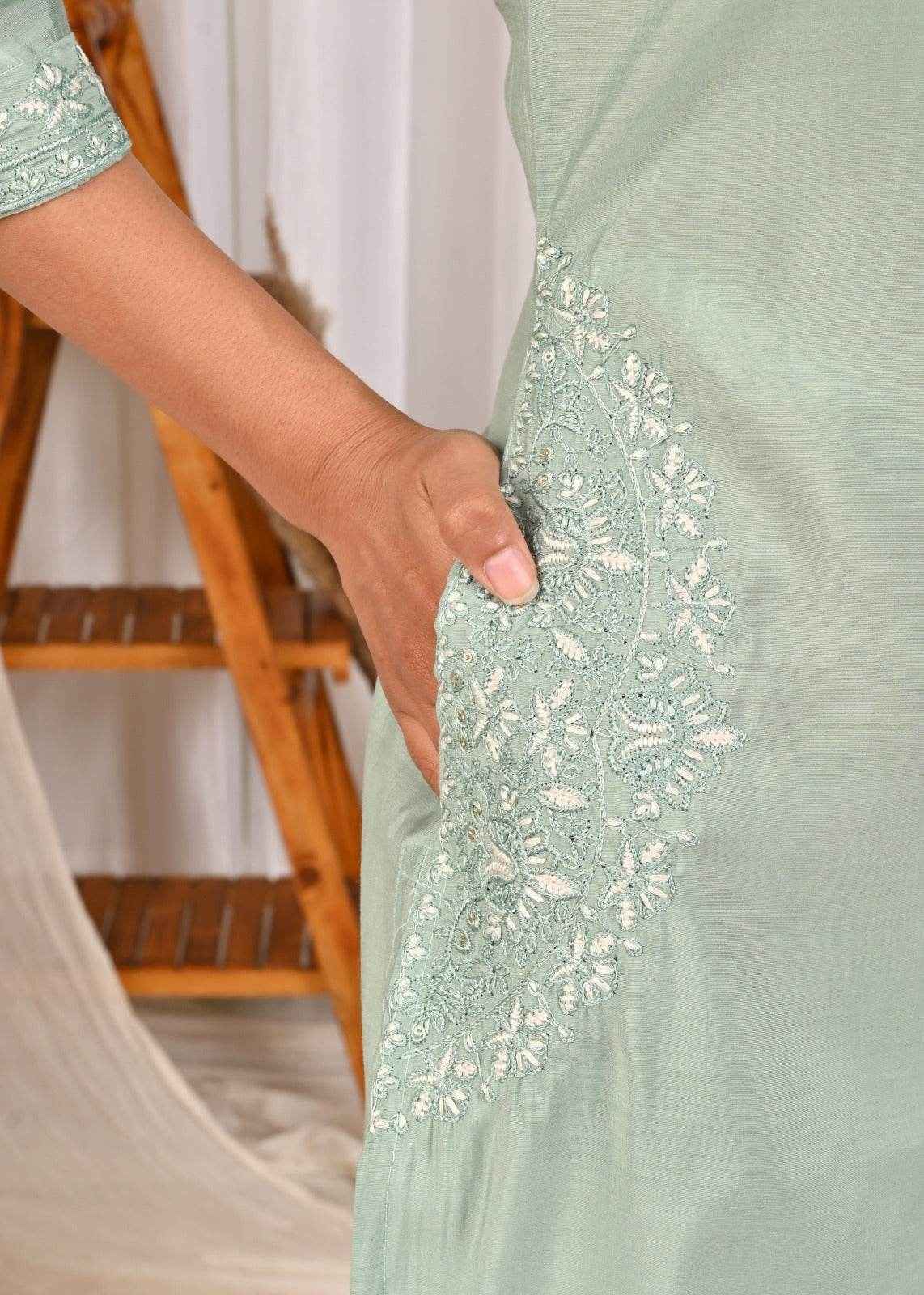 Pastel mint green silk kurta featuring intricate embroidery and a convenient side pocket