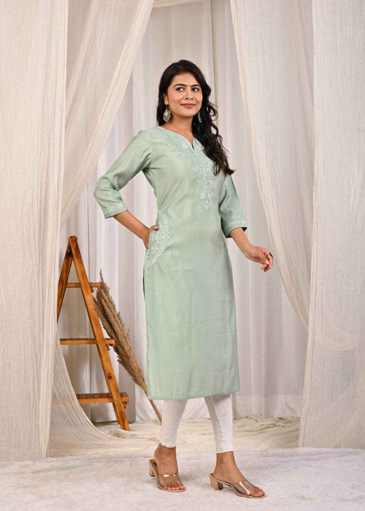 Elegant pastel mint green silk kurta with intricate embroidery, perfect for festive occasions