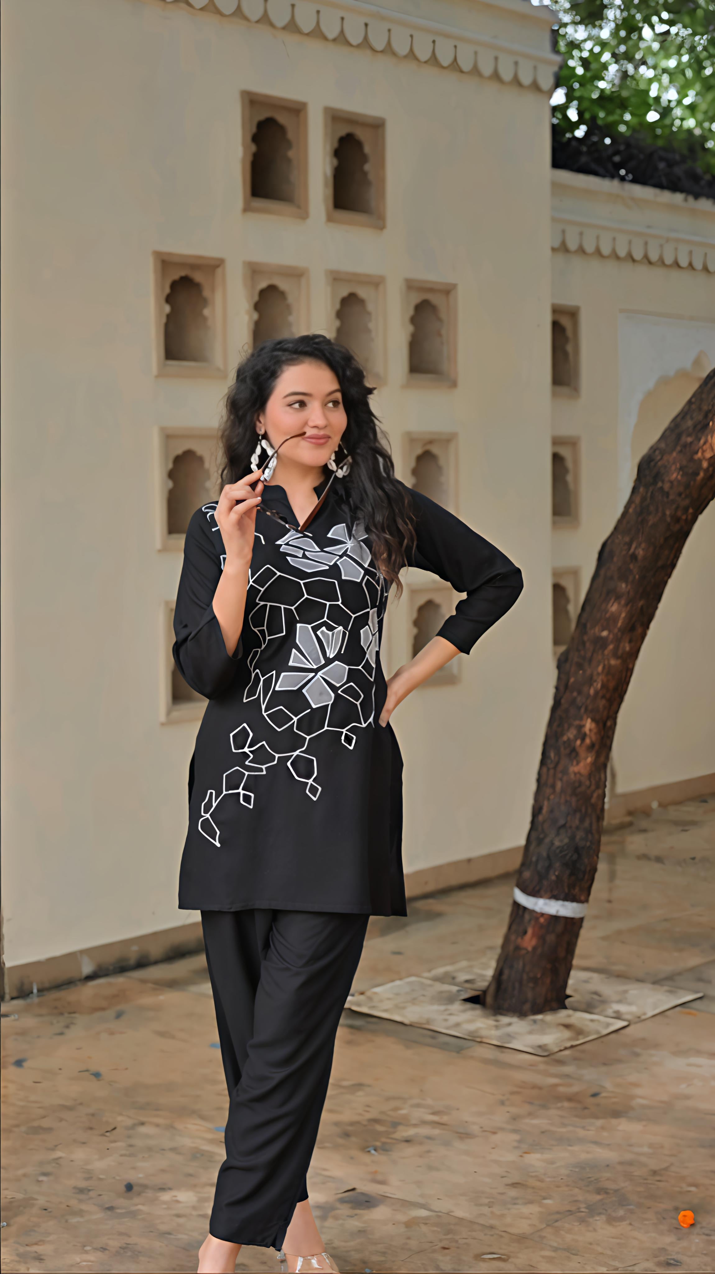 Elegant women's embroidered kurta set in black featuring floral embroidery and comfortable fit