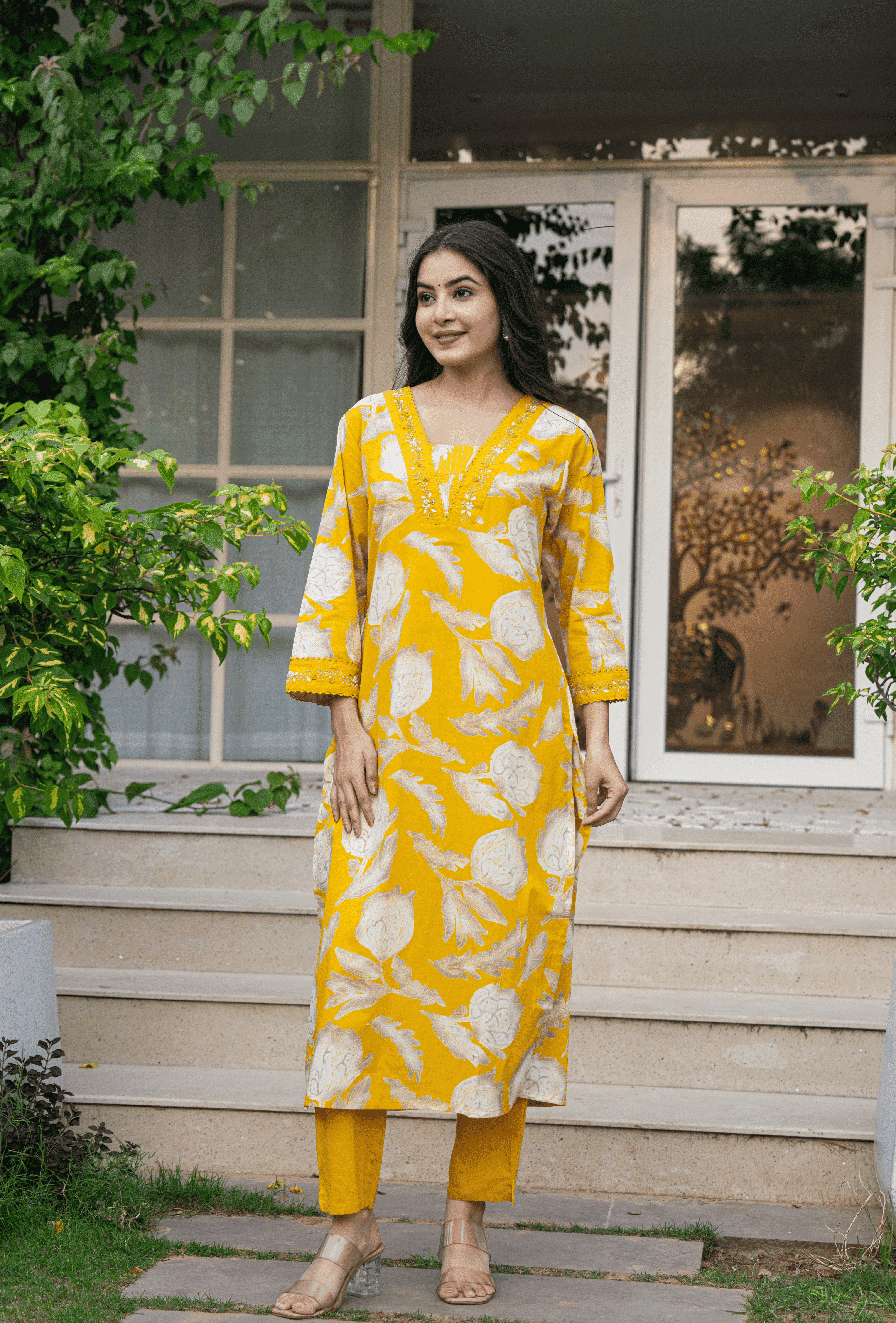 Stylish yellow Indian cotton suit online with floral print and 3/4 sleeves for a trendy look