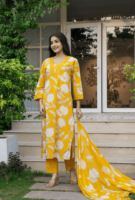 Yellow Indian cotton suit online featuring intricate floral patterns and elegant design for casual wear