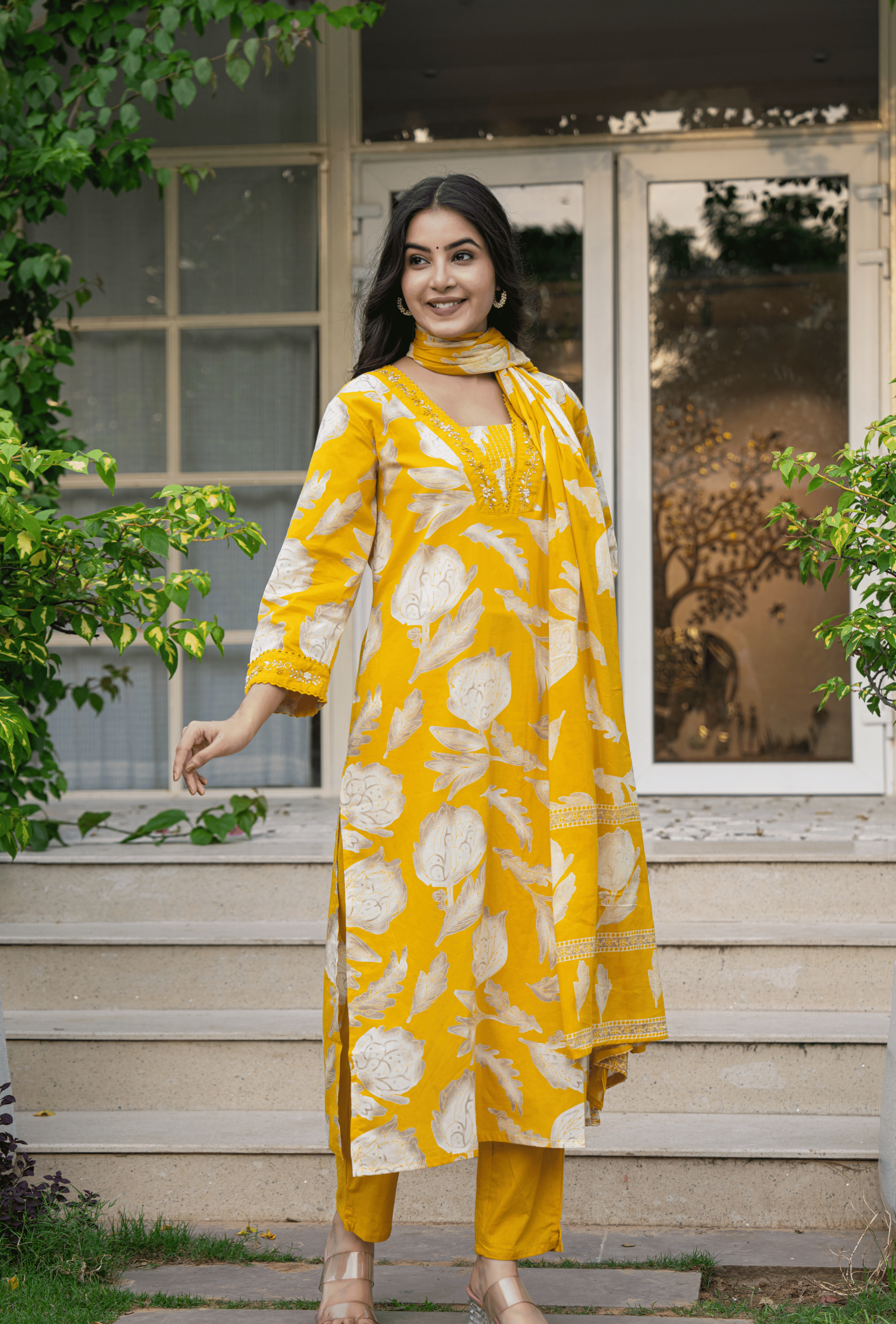 Yellow Indian cotton suit online with floral patterns and matching dupatta, perfect for festive occasions