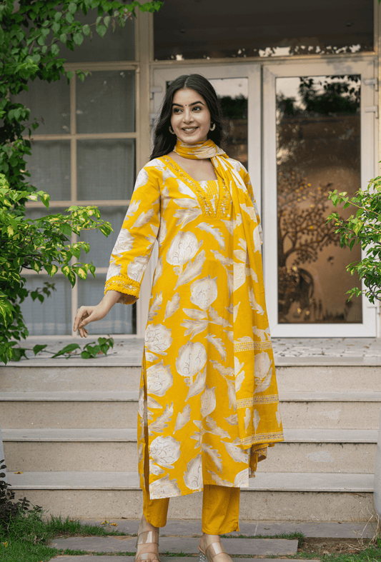Yellow Indian cotton suit online with floral patterns and matching dupatta, perfect for festive occasions